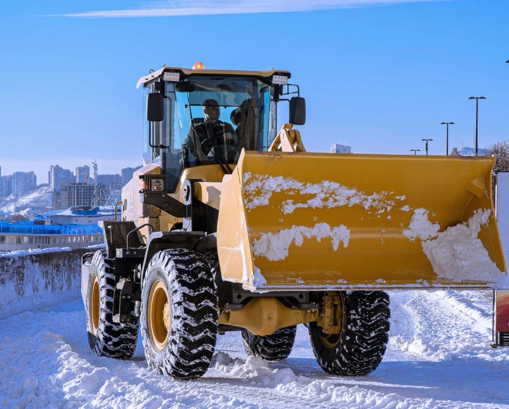 Machinery plowing snow